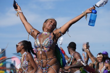 A reveller takes part in the Toronto Caribbean Carnival, on Saturday, August 5, 2023. THE CANADIAN PRESS/Chris Young