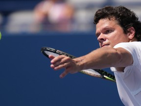 Canada's Milos Raonic hits the ball into the crowd after his straight sets win over Japan's Taro Daniel at the National Bank Open in Toronto on Wednesday, Aug. 9, 2023.