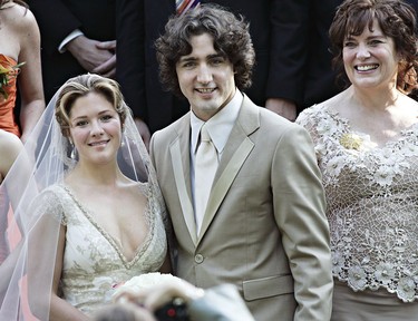 Justin Trudeau, son of the late Prime Minister Pierre Trudeau poses for photos with  his new bride Sophie Gregoire as his mother, Margaret, looks on after their marriage ceremony in Montreal Saturday, May 28, 2005.(CP PHOTO/Ryan Remiorz)