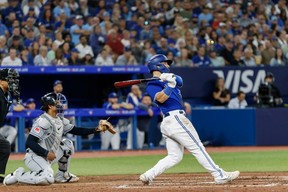 Blue Jays outfielder Daulton Varsho smacks a two-RBI single in the seventh inning versus Cleveland on Saturday. Cole Burston/Getty Images