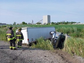 Firefighters respond to a rollover.