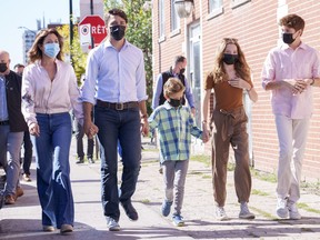 Liberal leader Justin Trudeau arrives to cast his ballot in the 44th general federal election as he's joined by wife Sophie Gregoire-Trudeau, and children, Xavier, Ella-Grace and Hadrien in his riding of Papineau, Montreal on Monday, Sept. 20, 2021. THE CANADIAN PRESS/Paul Chiasson