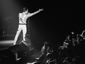 Black and white photo of Freddie Mercury during performance in France