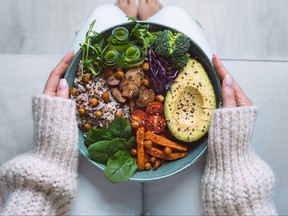 Healthy plant based Buddha bowl with fresh vegetables.