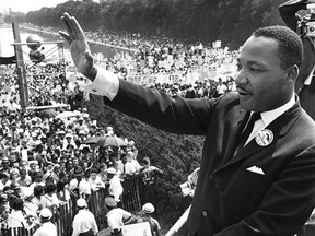 U.S. civil rights leader Martin Luther King, Jr. waves to supporters Aug. 28, 1963 from the Lincoln Memorial on the Mall in Washington D.C. during the "March on Washington."