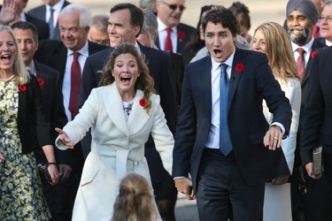 Sophie Gregoire (L) and Justin Trudeau react to seeing their children as the Liberal government is sworn in at Rideau Hall in 2015. (Wayne Cuddington/Postmedia)