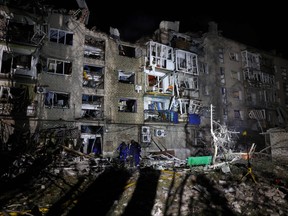 Rescuers are at work near a damaged residential building following Russian missiles strikes in Pokrovsk, Donetsk region, amid Russian invasion of Ukraine