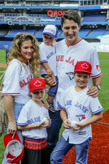 Justin Trudeau with his wife Sophie and kids Xavier, Ella and baby Hadrien, arrive at the Rogers Centre for the Blue Jays game in Toronto on Friday September 4, 2015. Dave Thomas/Toronto Sun