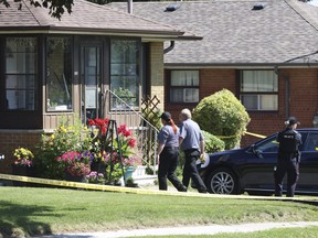 Members of the Special Investigations Unit (SIU) are pictured at a home located at 6 Sherwood Ave. in Scarborough after a shooting on Tuesday, Aug. 1, 2023.