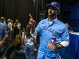 Jose Bautista gestures after addressing the media.