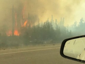 Wildfire seen from the road in Northwest Territories