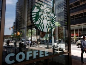 In this file photo taken on May 29, 2018 the Starbucks logo it's seen outside a store in Philadelphia.