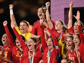 Spain's defender #05 Ivana Andres lifts the trophy