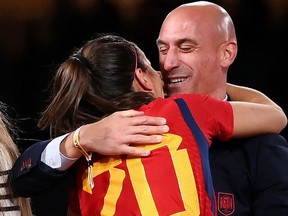 Spain's defender #20 Rocio Galvez (L) is congratuled by President of the Royal Spanish Football Federation Luis Rubiales