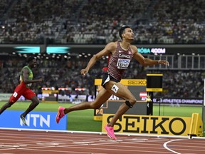 Pierce LePage races in the men's decathlon 400-metre race.