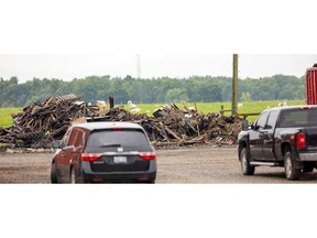 A pile of burnt debris is all that is left Tuesday, Aug. 15, 2023 after a barn fire on Aug. 13 at 44403 Southdale Line in Central Elgin. The hay barn was ignited by a firework that misfired into the barn. (Mike Hensen/The London Free Press)