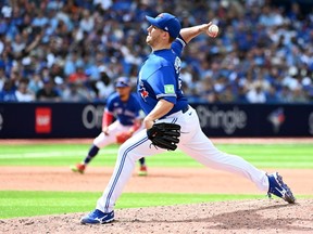 The Toronto Blue Jays placed right-hander Erik Swanson on the 15-day injured list on Sunday.&ampnbsp;Swanson (50) throws to a Chicago Cubs batter in eighth inning MLB interleague baseball action in Toronto, Sunday, Aug. 13, 2023.