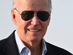 U.S. President Joe Biden makes his way to board Air Force One at Joint Base Andrews in Maryland on Aug. 18, 2023, as he departs for Lake Tahoe, Nevada.