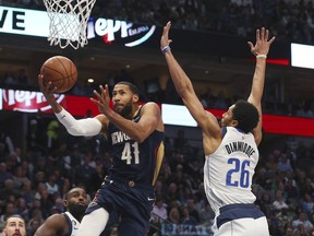 New Orleans Pelicans forward Garrett Temple (41) goes up for a shot against Dallas Mavericks guard Spencer Dinwiddie (26) in the first half during an NBA basketball game on Saturday, Jan. 7, 2023, in Dallas. The Toronto Raptors have signed free agents Temple, Mouhamadou Gueye, and Kevin Obanor, the team announced Tuesday.THE CANADIAN PRESS/AP/Richard W. Rodriguez