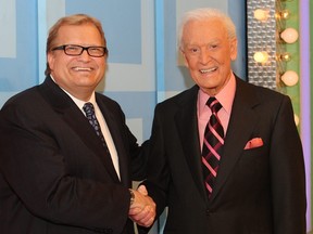 Host Drew Carey (left) and former host Bob Barker speak during a segment of "The Price Is Right" at CBS Television City on March 25, 2009 in Los Angeles, Calif.