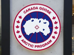 A Canada Goose Clothing company logo is displayed on a storefront in Ottawa on Saturday Sept. 10, 2022. Canada Goose Holdings Inc. says its most recent quarter delivered a $85 million net loss as it opened a handful of new international stores.THE CANADIAN PRESS/Sean Kilpatrick