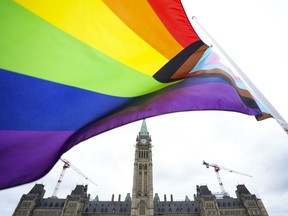 Canada is warning members of the LGBTQ+ community that they may face discrimination if they travel to some places in the United States. A Pride flag flies on Parliament Hill in Ottawa on June 8, 2023.