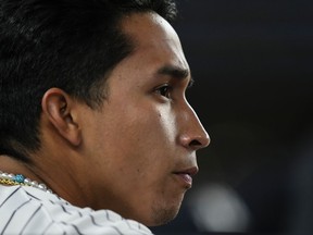CORRECTS THE IDENTIFICATION OF THE PLAYER TO YANKEES OSWALDO CABRERA AND NOT ANTHONY VOLPE AS ORIGINALLY SENT - New York Yankees' Oswaldo Cabrera watches during the eighth inning of the team's baseball game against the Washington Nationals on Tuesday, Aug. 22, 2023, in New York.