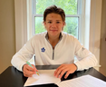 Easton Cowan signs with the Maple Leafs.