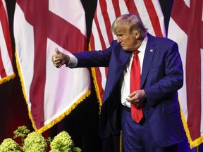 Former President Donald Trump gestures after speaking at a fundraiser event for the Alabama GOP, Friday, Aug. 4, 2023, in Montgomery, Ala.
