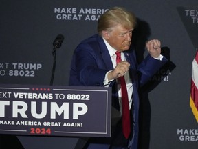 Republican president candidate former President Donald Trump dances at the conclusion of his remarks at a campaign rally, Tuesday Aug. 8, 2023, at Windham High School in Windham, N.H.