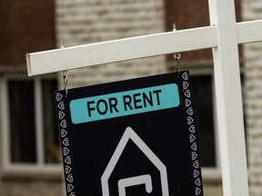 A rent sign is seen outside an apartment in Edmonton, July 5, 2022.
