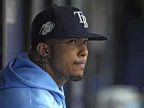 Tampa Bay Rays' Wander Franco watches from the dugout during the fifth inning of a baseball game against the Cleveland Guardians Sunday, Aug. 13, 2023, in St. Petersburg, Fla.