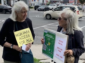 Pictured are two of the protesters who turned out to fight the city's decision to significantly reduce car-access to High Park.
