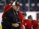 Calgary Flames head coach Bill Peters gives instruction during training camp in Calgary on September 13, 2019. Bill Peters has been named the new head coach of the Lethbridge Hurricanes. Peters has coached at every level of men's hockey, including the Western Hockey League, NHL and internationally for Canada.