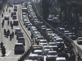 Vehicles are caught in a congestion during a rush hour in Jakarta, Indonesia, Thursday, Sept. 9, 2021. Indonesian authorities are blaming the dry season and and motorized vehicles as the main causes of air pollution in Jakarta, after a Swiss air quality technology company named the city as the most polluted in the world.