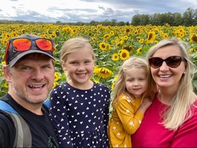 Karolina "Caroline" Huebner-Makurat, who was killed by a stray bullet during a shootout in Leslieville on July 7, 2023, is seen here with her husband Adrian and daughters Claudia and Nella.