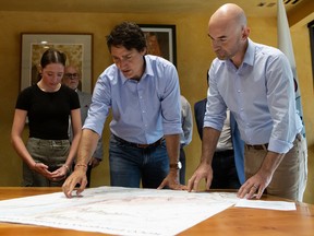 Prime Minister Justin Trudeau looks over a map