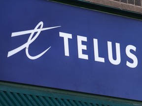 A Telus sign is seen on a storefront in Halifax on Thursday, Feb. 11, 2021.