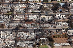 In an aerial view, homes and businesses are seen that were destroyed by a wildfire on Aug. 11, 2023 in Lahaina, Hawaii.
