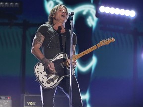 FILE - Keith Urban performs "Texas Time" at the 58th annual Academy of Country Music Awards on May 11, 2023, at the Ford Center in Frisco, Texas. Country superstar Urban and Kix Brooks of powerhouse country duo Brooks & Dunn will be inducted into the Nashville Songwriters Hall of Fame this year, according to an announcement by the organization Thursday, Aug. 3, 2023.