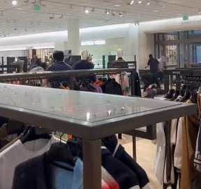 Looters can be seen exiting a Nordstrom store in Los Angeles with stolen goods. @Noelskeez/TWITTER