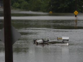 The top of a service truck is seen abandoned in floodwater following a major rain event in Halifax on Saturday, July 22, 2023.