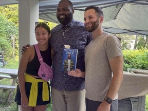 From left to right, Christina Hayes, former NFL football player Michael Oher, whose story became the inspiration for the Oscar-nominated movie "The Blind Side," and Sam Noel pose for a photo at Oher's book-signing at The Ivy Bookshop in Baltimore, Monday, Aug. 21, 2023. Last week, Oher sued Sean and Leah Anne Tuohy to lift his conservatorship with them.