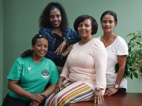 Meserat Demeke (centre right) President of the Ethiopian Association in the GTA poses with colleagues (left to right) Netsanet Alem, Tsedey Gashe and Mawordi Mohamed, in their Toronto offices, on Wednesday July 15, 2023.