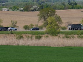 Traffic passes through the Duffins Rouge Agricultural Preserve, part of Ontario's Greenbelt, on Monday, May 15, 2023.