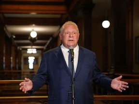 Ontario Premier Doug Ford speaks to journalists at the Queen's Park Legislature in Toronto on Friday August 25, 2023.&ampnbsp;Ford says he's confident that nothing criminal took place in his government's process of removing protected Greenbelt lands for housing development.THE CANADIAN PRESS/Chris Young