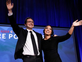 Pierre Poilievre and wife Anaida Poilievre wave onstage during Canada's Conservative Party leadership election in Ottawa September 10, 2022.
