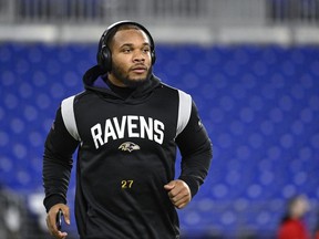 FILE - Baltimore Ravens running back J.K. Dobbins jogs on the field during pre-game warm-ups before of the NFL football game against the Pittsburgh Steelers, Sunday, Jan. 1, 2023, in Baltimore. Dobbins was back at practice Monday, Aug. 14, 2023, after beginning camp on the physically unable to perform list.