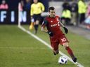 Toronto FC forward Sebastian Giovinco (10) keeps the ball in bounds as he runs up field during MLS soccer action against the Atlanta United in Toronto, Sunday, Oct. 28, 2018. Toronto FC has opened its doors again to Giovinco. The 36-year-old Italian is not back with the MLS club. But the former MLS MVP, has once again indicated his interest in resuming his career with Toronto colours and the team has offered to let the club legend use its north Toronto training facility.