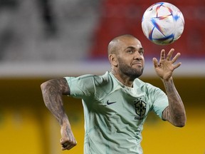 Brazil's Dani Alves practices during a training session at the Grand Hamad stadium in Doha, Qatar, on Dec. 4, 2022.